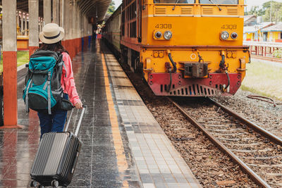 Rear view of man train at railroad station platform