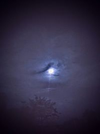 Low angle view of moon in sky at night