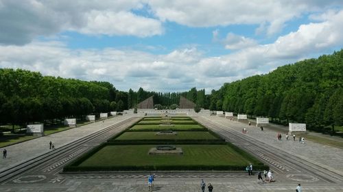 View of trees against cloudy sky