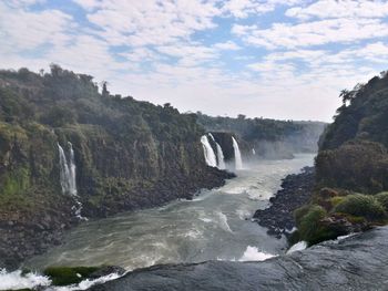 Scenic view of river flowing through rocks