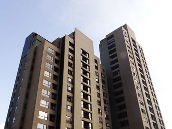 Low angle view of modern buildings against sky