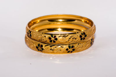 Close-up of metallic object on table against white background