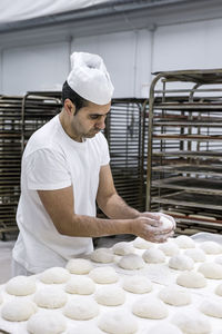 Baker preparing food in bakery
