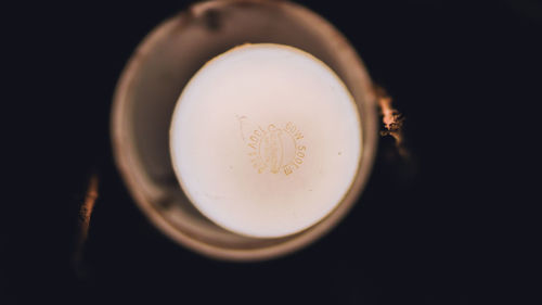 High angle view of illuminated lamp against black background