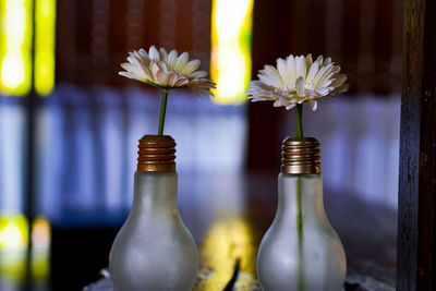 Close-up of white flower vase on table