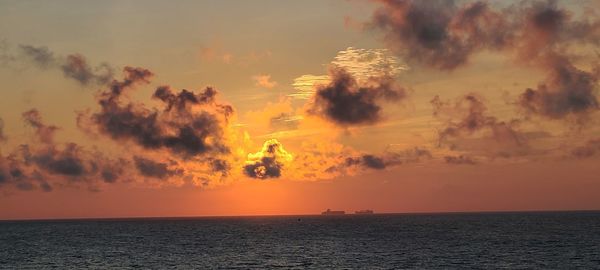 Scenic view of sea against sky during sunset