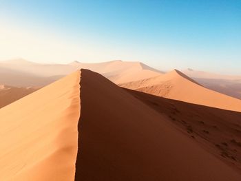 Scenic view of desert against clear sky