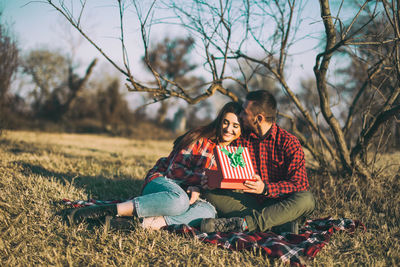 Couple sitting outdoors