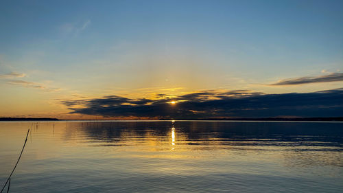 Scenic view of sea against sky at sunset