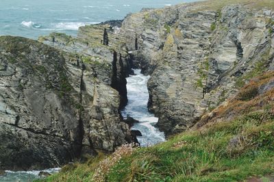 High angle view of rocks on sea shore