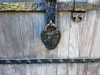 Close-up of padlocks on metal door