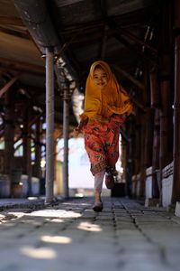 Portrait of a girl running towards the camera