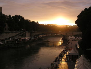 Bridge over river with city in background