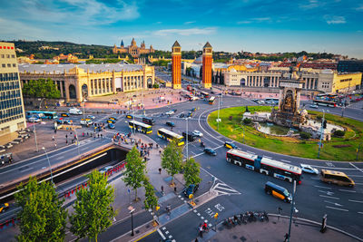 Placa d'espanya, barcelona, spain with city traffic on sunset