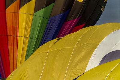 Low angle view of multi colored hot air balloon against sky