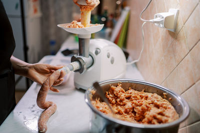 Midsection of man preparing food