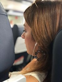 Portrait of woman sitting in car