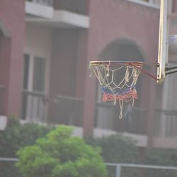 Low angle view of basketball hoop against building