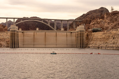 Bridge over river against sky