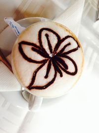 Close-up of coffee cup on table