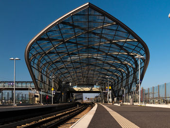 View of railroad station platform against clear sky