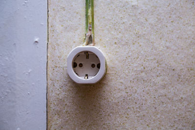 Close-up of outlet on wall