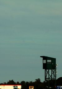 Low angle view of water tower against sky at dusk