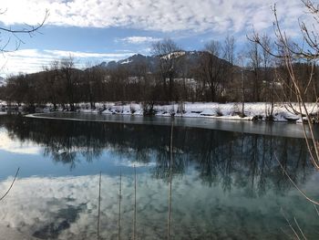 Scenic view of lake against sky during winter