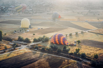Aerial view of hot air balloon on field