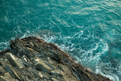 High angle view of rock in sea