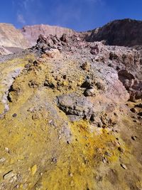 Scenic view of rocks on land against sky