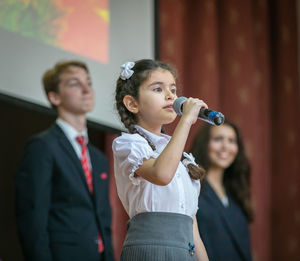 Full length of a girl looking at camera