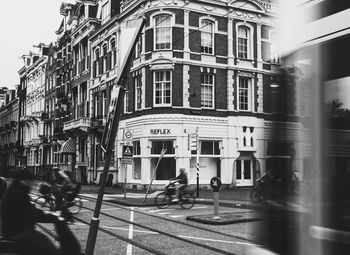 People walking in front of building