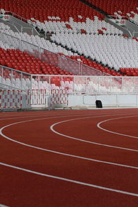 Empty running track against chairs