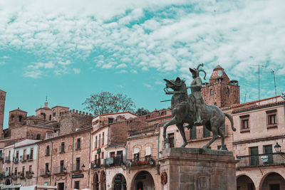 Statue of historic building against sky