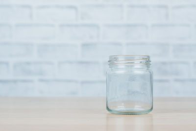 Close-up of glass jar on table