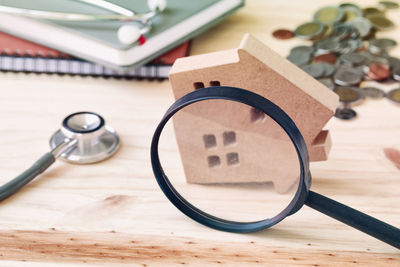 High angle view of magnifying glass on table