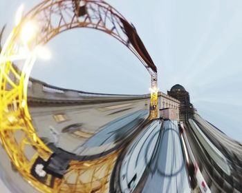 Ferris wheel in city against sky