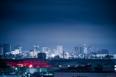 Illuminated buildings in city at night