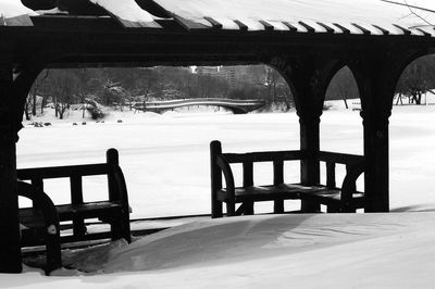 Close-up of chairs and table in park during winter