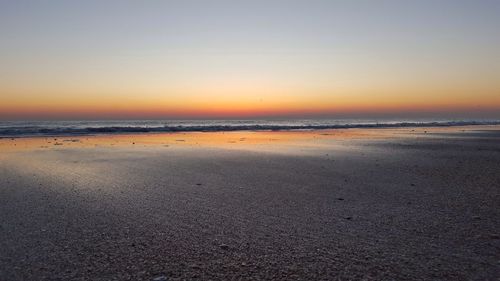 Scenic view of sea at sunset
