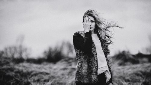 Close-up of woman against sky