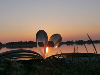 Heart shape against sky during sunset