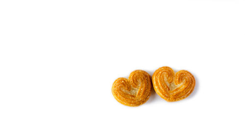 Close-up of heart shape over white background