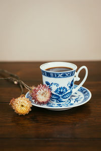 Close-up of coffee cup on table