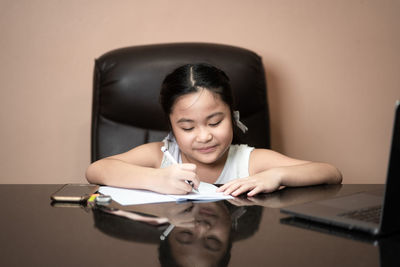 Girl sitting on table