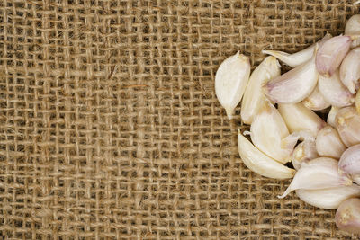 High angle view of garlics on jute