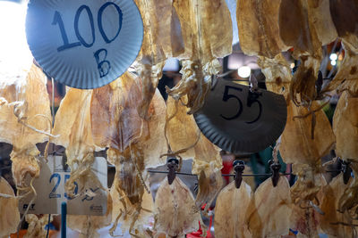 Low angle view of decorations hanging at market stall