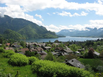 Scenic view of lake and mountains against sky