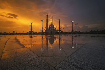 View of mosque against sky at sunset 